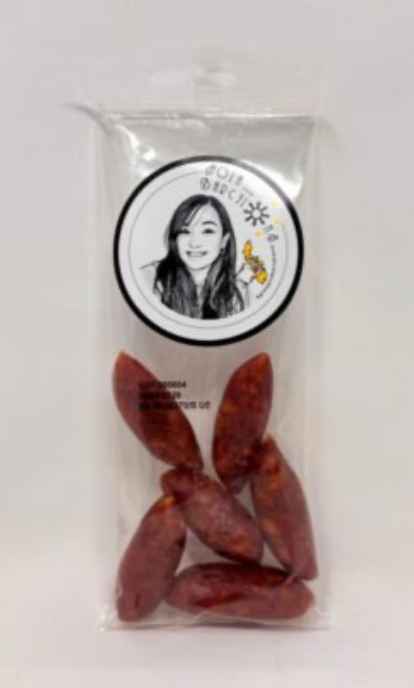 Packaged red dried fruits with a visible brand logo Pinay sa Barcelona on a white background