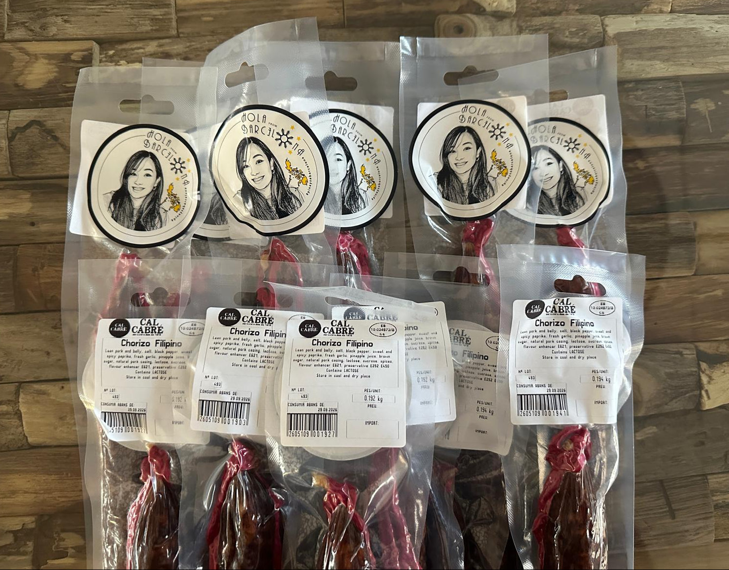 Packaged meat products with labels on a wooden surface